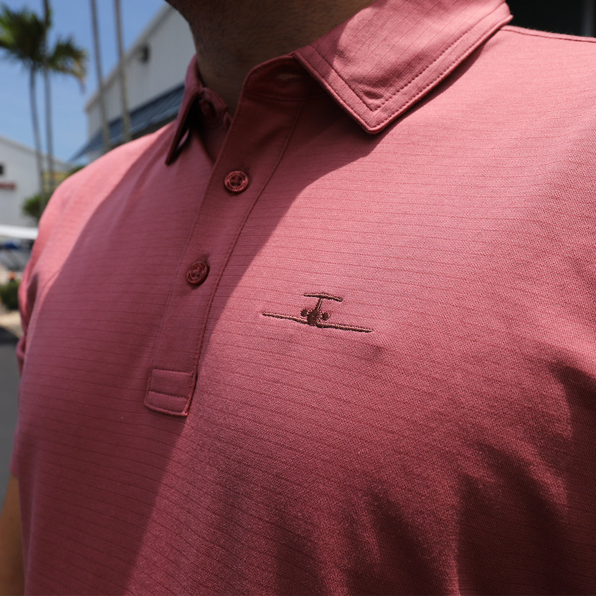 Banyan TravisMathew Performance Polo- Roan Rouge